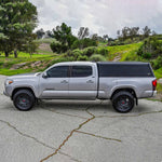 Load image into Gallery viewer, Westin 16-23 Toyota Tacoma 6ft. Bed EXP Truck Cap Black - Box 2 (Box 1 Required 16-14185A)
